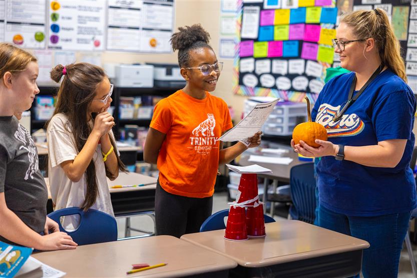 Students do a pumpkin STEM challenge